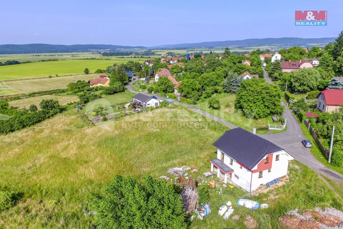 Prodej pozemku 1.041 m², Lhotka, Středočeský kraj